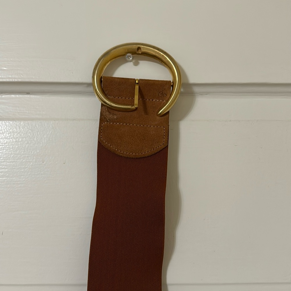 Vintage belt fits size small to medium.